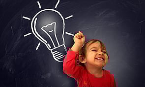 Small child with light bulb above head