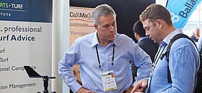 Conference exhibitor talking with a client