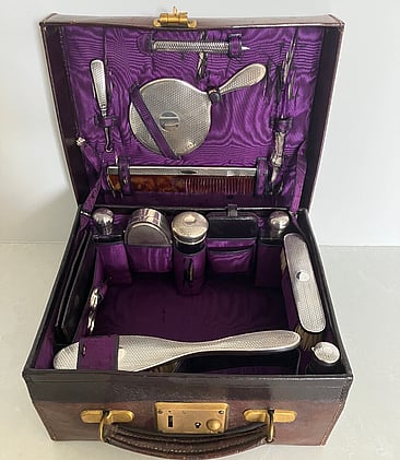 George V leather vanity case with sterling silver vanity set
