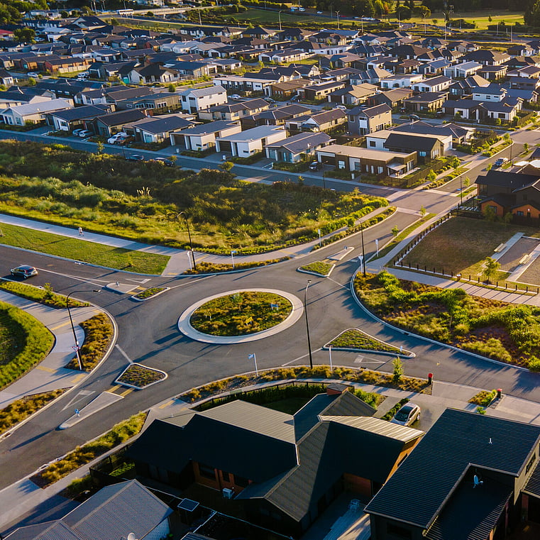Drone shot of Roundabout with homes on the right side