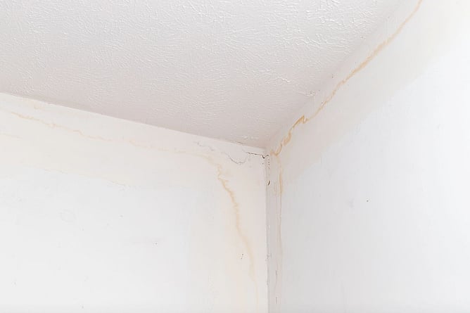 stained walls and ceiling from roof leaking