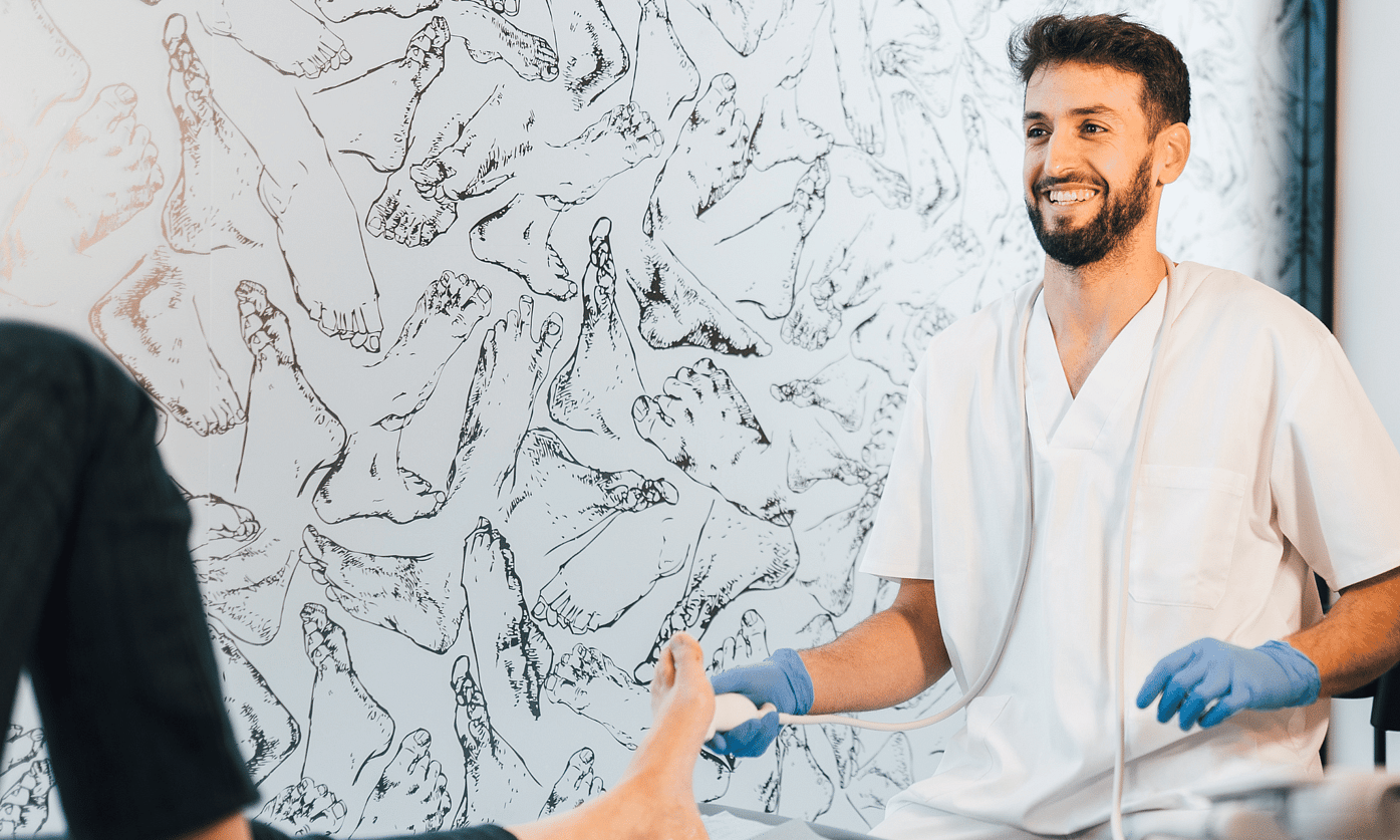 Podiatrist diagnosing and managing osteochondral ankle lesion with orthotics and rehabilitation at Foot Foundation