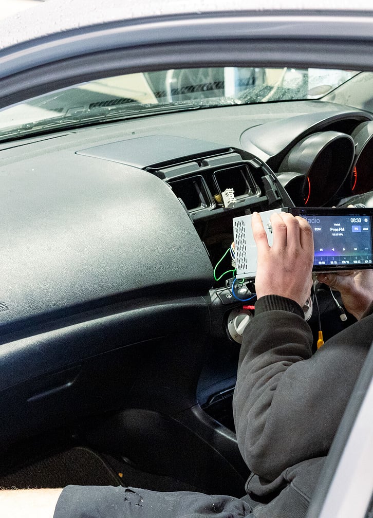 Man working at connecting up a radio system