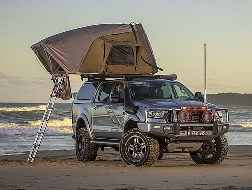ARB esperance rooftop tent set up on a Ford Ranger on a beach