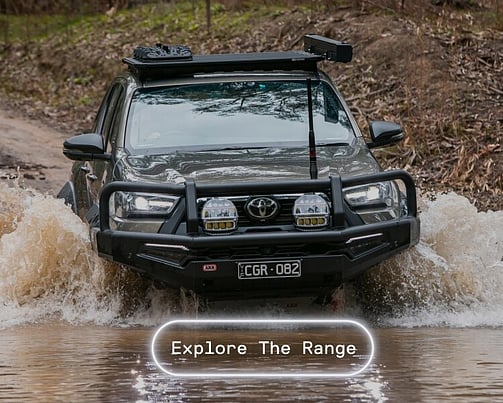 Vehicle with driving lights going through river crossing