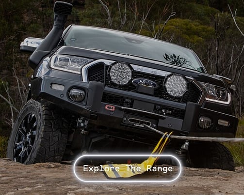 4WD vehicle coming over rose with winch assistance