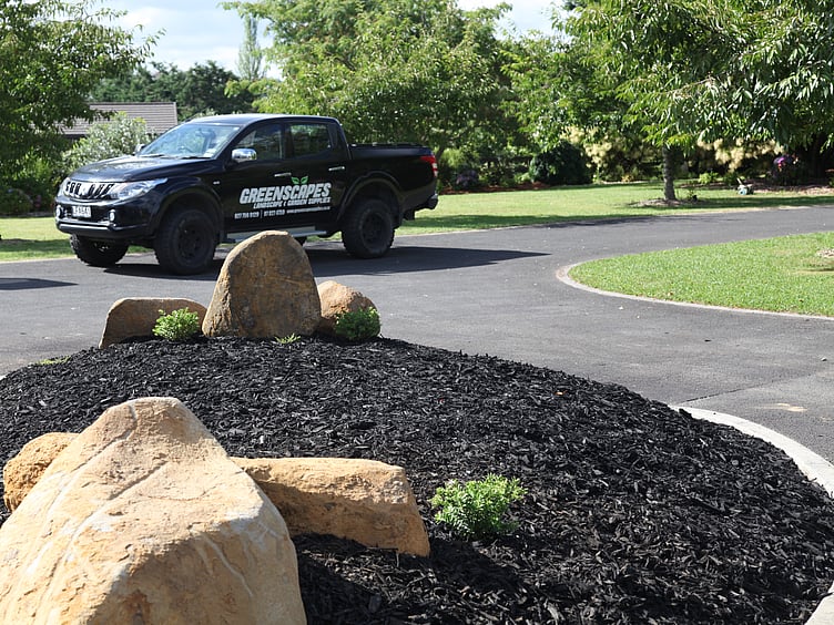 Mulch and feature boulders plus greenscapes ute