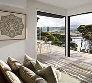 Master bedroom ensuite with stacking slider doors, indoor‑outdoor flow, Nixon Homes