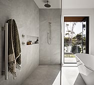 Bathroom interior detail &mdash; flush hidden bathroom door, seamless design, Nixon Homes build