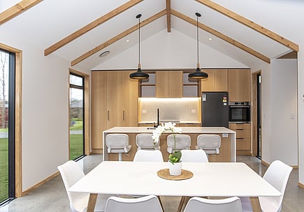 Kitchen and dining area with raking ceiling – Waikato rural build