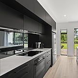 Open‑plan living room with large windows &mdash; modern family lifestyle, Nixon Homes Waikato