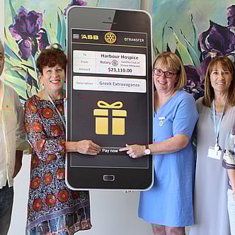 A giant cheque being presented to Harbour Hospice