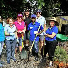 Rotarians posing for a photo after a garden clean up
