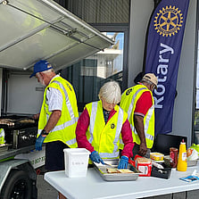 Rotarians in action at a sausage sizzle