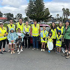A group of volunteers getting ready for a beach clean up