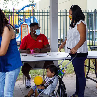 People standing in line to get a vaccination