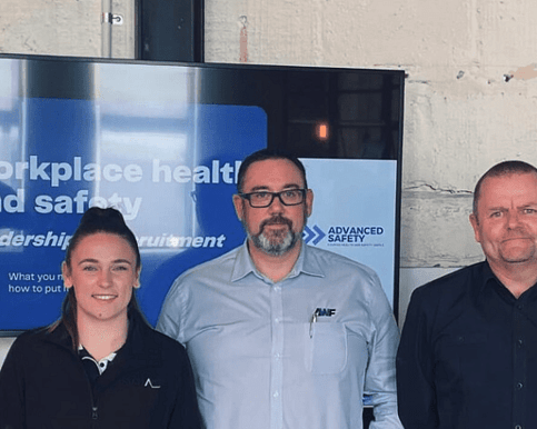 Advanced Safety training attendees standing together after receiving a workplace health and safety leadership training session in New Zealand.