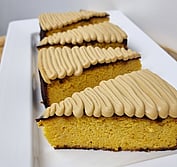 Soft orange cake topped with white chocolate and espresso ganache.