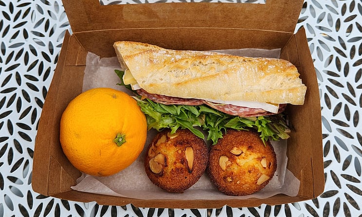 Our Take away option offering financiers, a filled roll and a piece of fruit