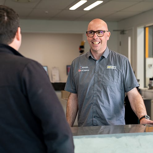 Employee from Performance Diesels greeting a customer