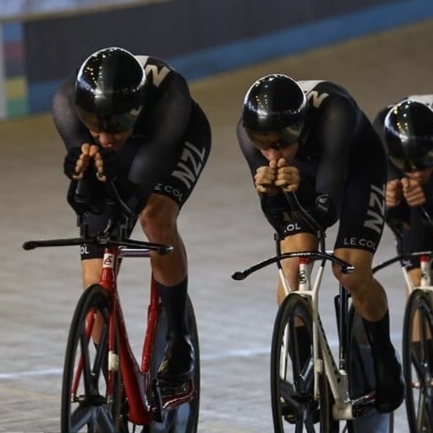 Picture of track cyclists riding the Team Pursuit wearing the NZ skinsuit
