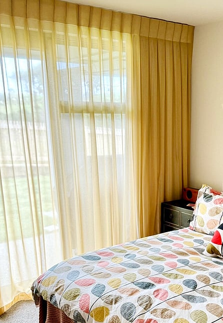 Image of floral roman blinds and matching fabric cushions and pillows in bedroom. Curtain packages coming soon by Julia Empson Interior Design & Styling. Te Awamutu, Hamilton, Waikato. NZ