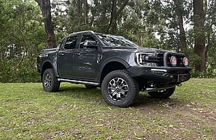 Featuring an ARB Summit Sahara Bar with Optional Embedded 20" LED Lightbar, Revo 10,000lb Winch, ARB Intensity Solis Driving Lights, OME Suspension Lift, ARB Recovery Point, ARB Under Vehicle Protection Plate, ARB Side Steps and Hercules Terra Trac Tyres.