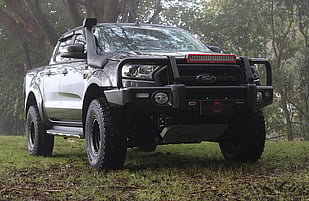 2017 Ford Ranger PKII Featuring an ARB Summit Bullbar with Fog Lights, ARB Intensity LED Light Bar, TJM Snorkel, OME 50mm Suspension Lift, ARB Under Vehicle Protection Plate, Flares, Mickey Thompson ATZ P3 Tyres & 16" Wildland Evade Imitation Bead Lock Wheels