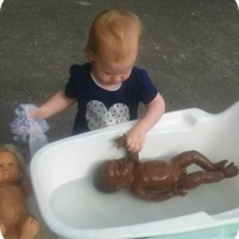 Sprouts Napier child baths doll