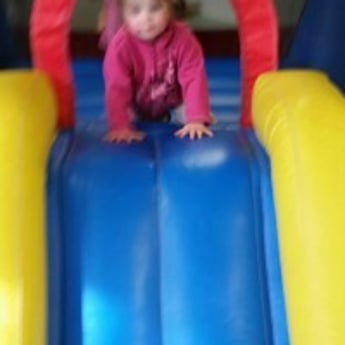 Child heading down slide