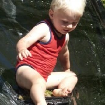 Water slide fun for toddler at Sprouts