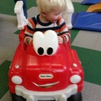 Sprouts child drives fire engine