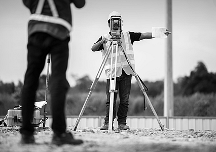 Man using surveying equipment