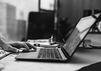 Hands using a laptop computer