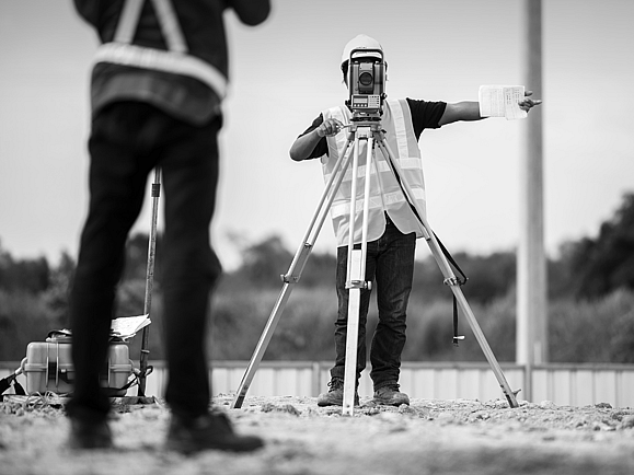 surveyors using surveying equipment