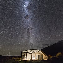 Milky Way rising above SkyScape glass-roof cabin in the Mackenzie Basin