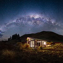 Glass-roof cabin beneath the Milky Way in the Dark Sky Reserve