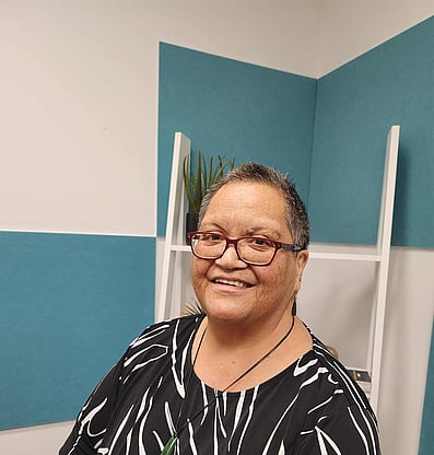 Marlene (Ma) smiling for her photo wearing a pounamu 