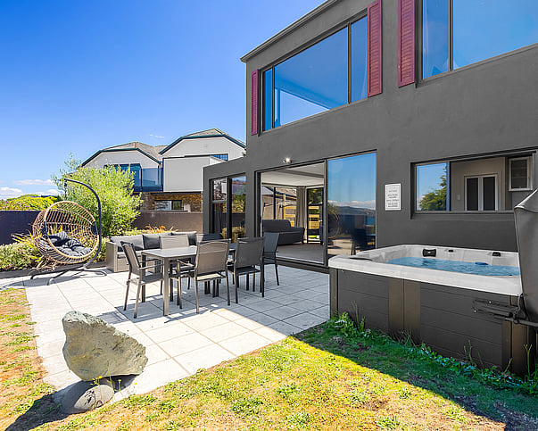 Outdoor dining and spa pool at Gather Taupo