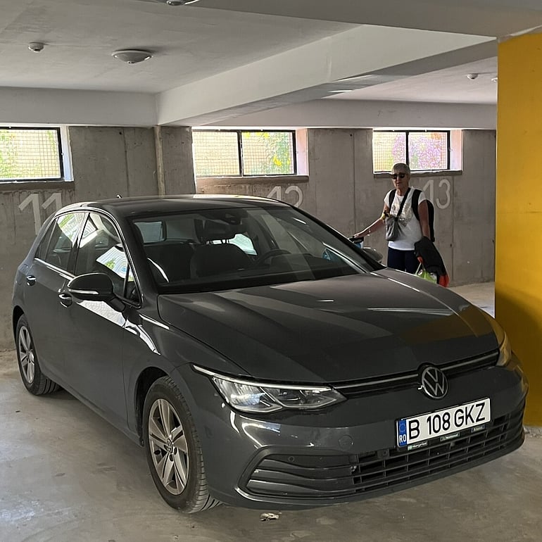 VW Golf parked in an underground carpark.