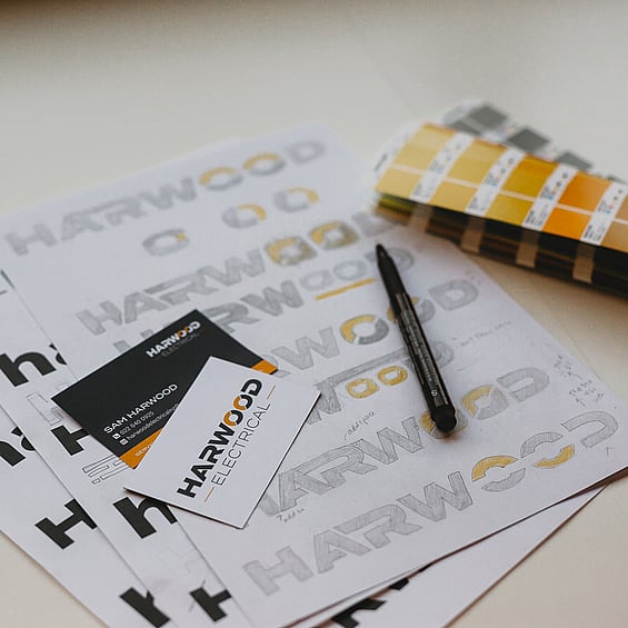 Image of Harwood Electrical logo, business card and sketches. By Creative Box