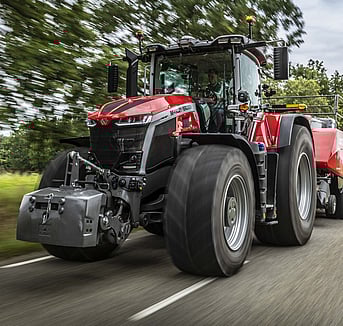 Massey Ferguson 9S on the road with a Baler