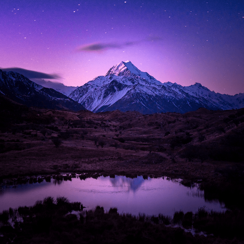 Mount Cook at night under a purple sky