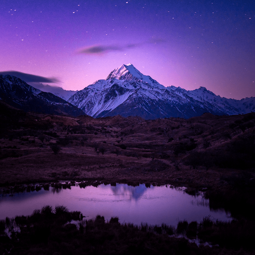 Mount Cook at night under a purple sky