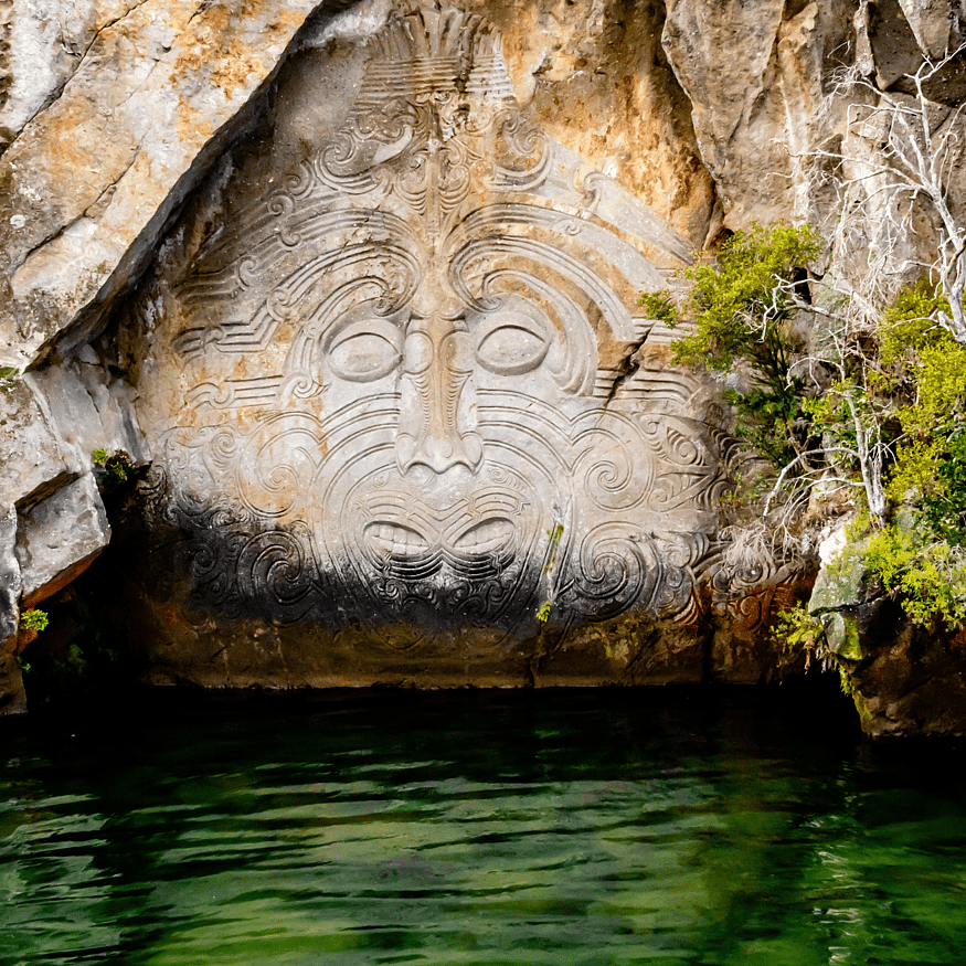 Māori rock carvings on Lake Taupō with calm water