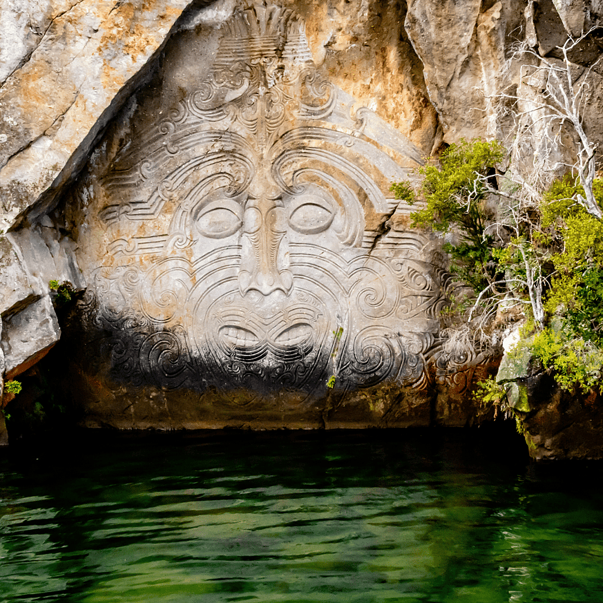 Māori rock carvings on Lake Taupō with calm water