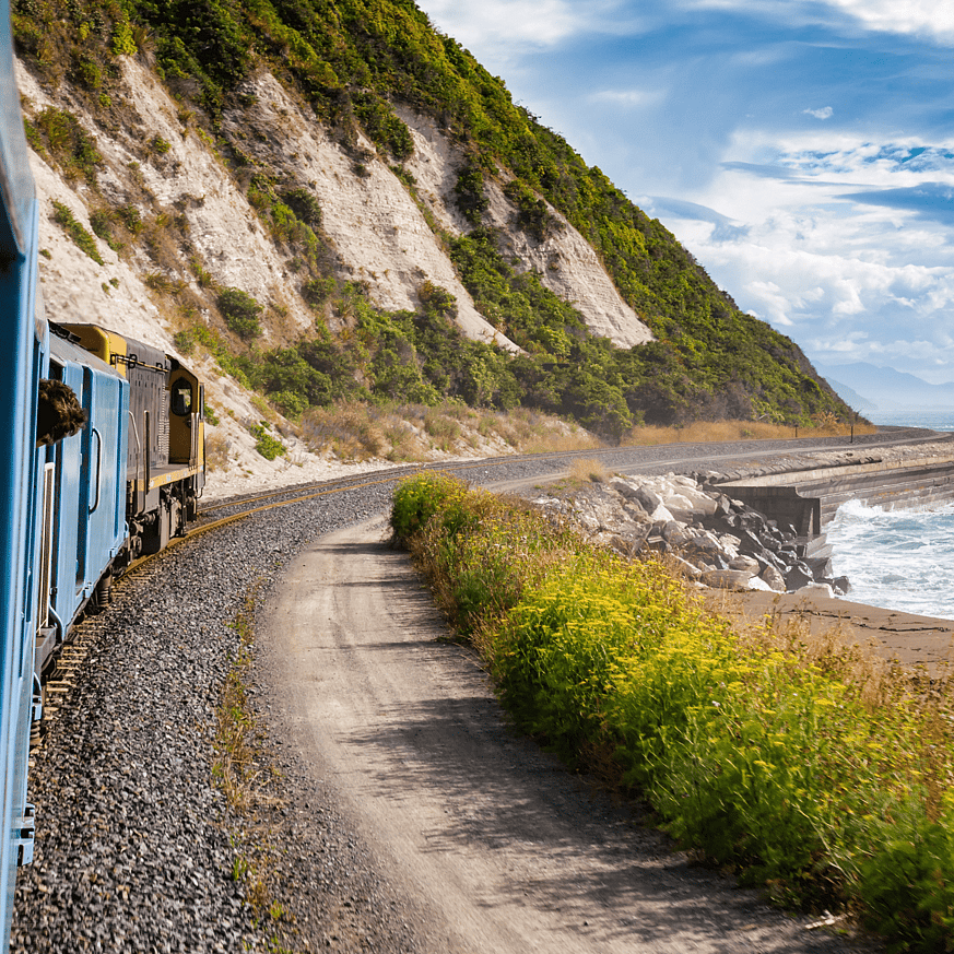 Coastal Pacific Train running along the Kaikōura coastline