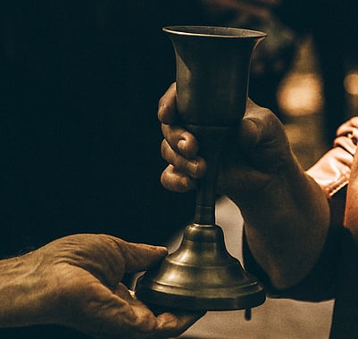 Chalice and hand. 