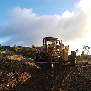 Hawke's Bay Forest Roading, Maintaining a track in a Hastings Forest in Hawke's Bay, metalling a road in Hastings, Shingle onto road in Hastings, Earthmoving in a Hastings Forest