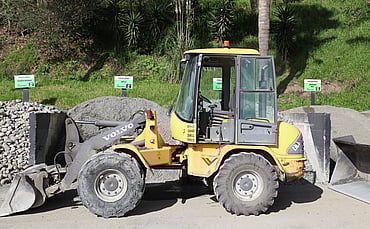 An iconic part of the scenery, the little yellow loader is as reliable a machine for Greenscapes as she was 20 years ago.